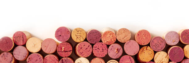 istock Wine corks panorama with copy space, overhead shot on a white background 1302210794