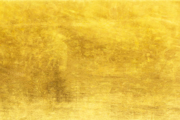 istock grunge gold abstract background or texture and gradients shadow 1302210817