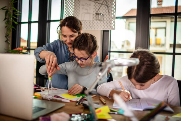 istock Mother Helping Their Daughter With Homework 1302211420