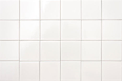 Soft light white abstract white tiny square ceramic tiles texture, background, top view. White covering of bathroom, kitchen, spa salon, pool in pure modern style.