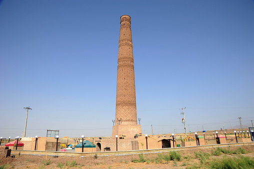 Sebzevar, Iran - June 28, 2011: Husrevgird Minaret was built in 1111 during the Great Seljuk period. The brick decorations on the minaret are remarkable.