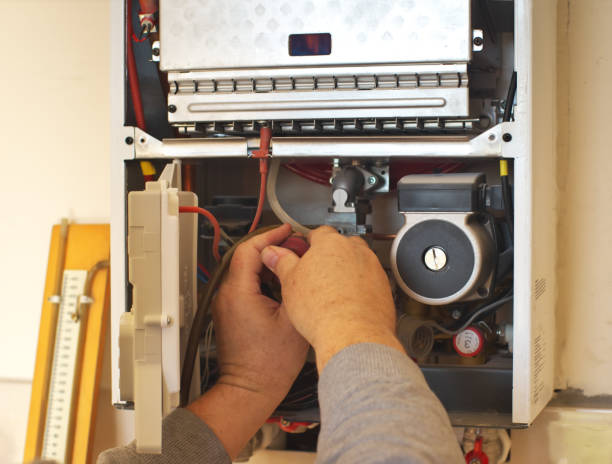 istock Man engineer and gas heater. 1302217152