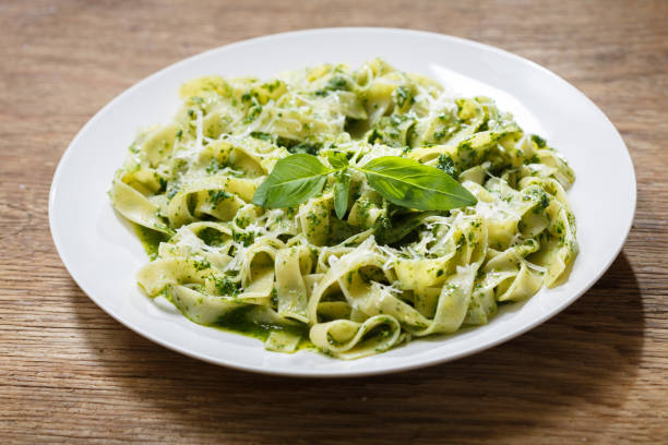 istock plate of pasta with pesto sauce 1302217408