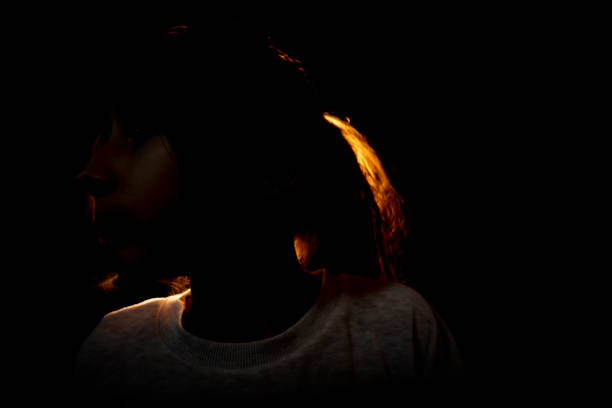 istock Little girl portrait with back light 1302217602