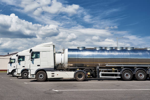 istock Trucks with tank trailer on parking lot 1302219909