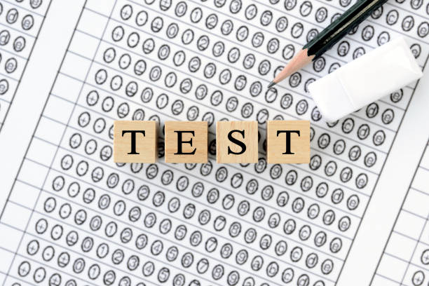 istock Wooden blocks with TEST words on mark sheet 1302219987