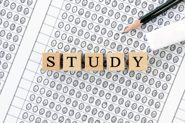 istock Wooden blocks with STUDY words on mark sheet 1302220027