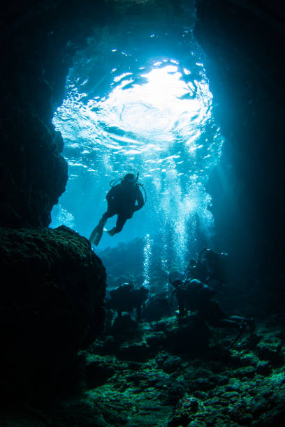 istock Divers in a cave at the famous Maeda Blue cave Okinawa 1302225024