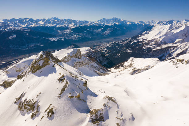 aerial view of the plaine morte glacier at the top of the crans montana ski resort with a view on the central valais valley in the swiss alps in switzerland on a sunny winter day - european alps switzerland glacier high angle view imagens e fotografias de stock