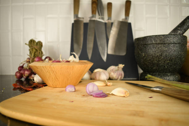 istock garlic onion and dry red chilli on black mable table in kitchen 1302227498