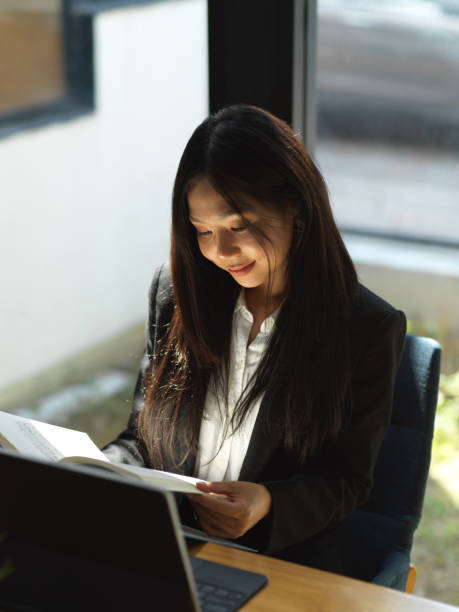 istock Businesswoman working with document file and digital tablet on coffee table 1302227639