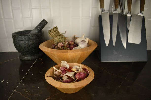 istock garlic and red onion on a kitchen table in a wooden boel 1302227866