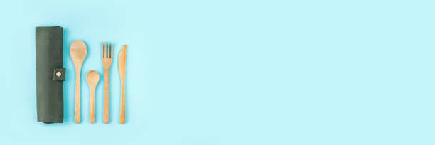 istock Banner made from eco friendly bamboo cutlery set on blue background. 1302229764