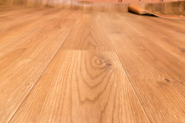 istock Vinyl flooring with wooden planks pattern imitation during laying 1302230613
