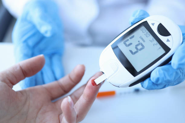 Doctor measuring patients blood glucose with glucometer closeup Doctor measuring patients blood glucose with glucometer closeup. Diagnosis of diabetes concept glucose photos stock pictures, royalty-free photos & images