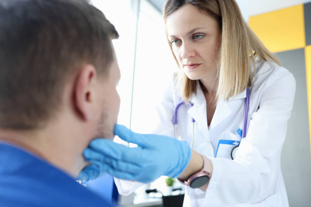 istock Female doctor palpating patients submandibular lymph nodes 1302230864
