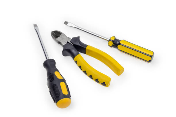 istock Two screwdrivers and diagonal pliers with yellow insulated handles 1302233582