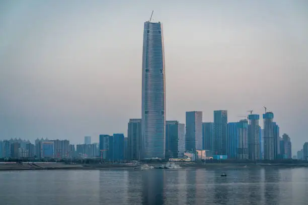 Wuhan skyline and Yangtze river with supertall skyscraper under construction in 2021 in Wuhan Hubei China