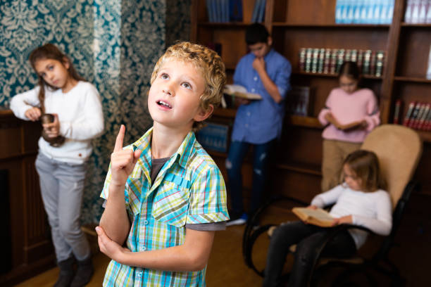 istock Preteen boy thinking about solving puzzle in escape room 1302236161
