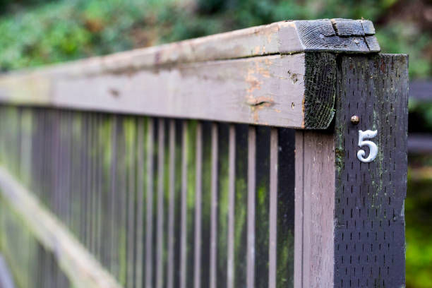 istock Number 5 on a wooden fence 1302236309