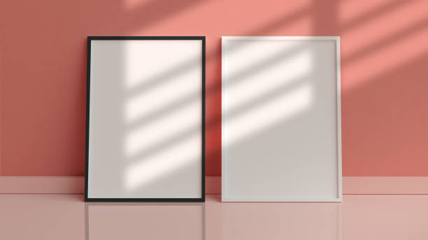 istock Two vertical poster frames mockup on the floor leaning against the room wall in 3D rendering. Modern home interior design, blank empty frame template, scandinavian style 1302237311