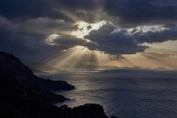 istock Heavenly beams of sunlight break the darkness 1302237959