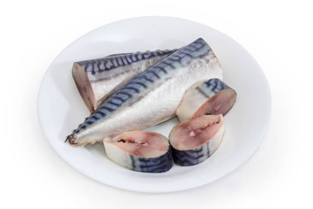 istock Partly sliced pickled mackerel on dish on a white background 1302238705