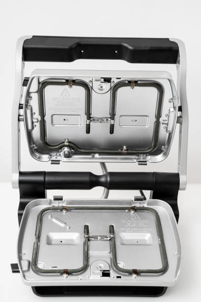 istock electric grill with open lid. the panels were removed 1302239188