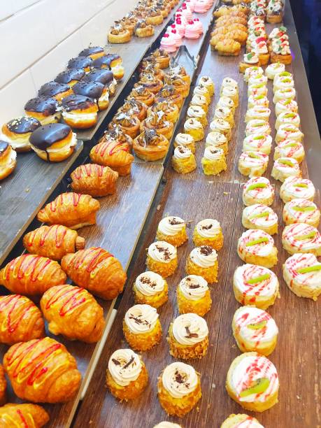 istock a showcase with a large selection of doughnuts and cakes 1302240088