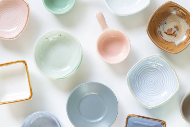 istock Colorful empty plates on white background. flat lay, top view 1302246802