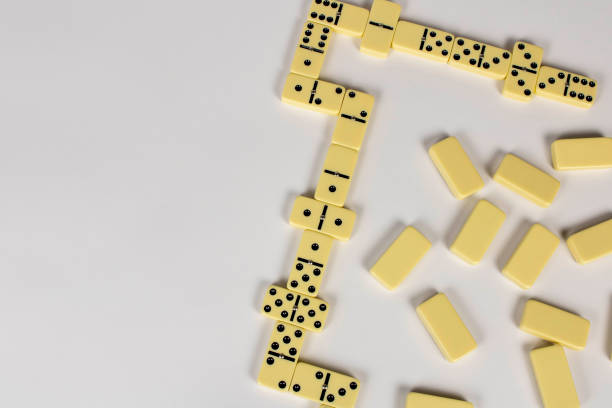 istock A game of dominoes on a light background. Close-up. Selective focus. 1302247173