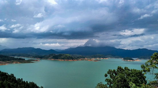 This is the larges dam in Lampung, Indonesia called Batu Tegi Dam. The water is bluish green with several small islands around it.