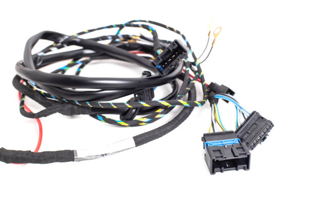 istock Braided automotive wiring with electrical connectors on white background, isolate. Close-up 1302248403