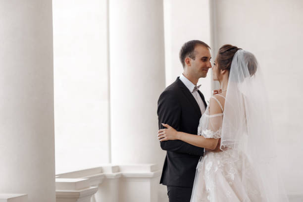 istock Bride and groom in wedding dress outdoors on celebration day 1302249309