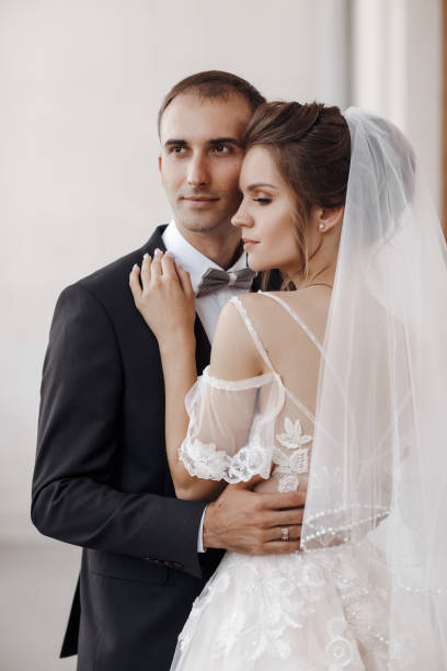 istock Bride and groom in wedding dress outdoors on celebration day 1302249318