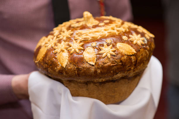 istock ruddy wedding loaf in hands close-up 1302250116