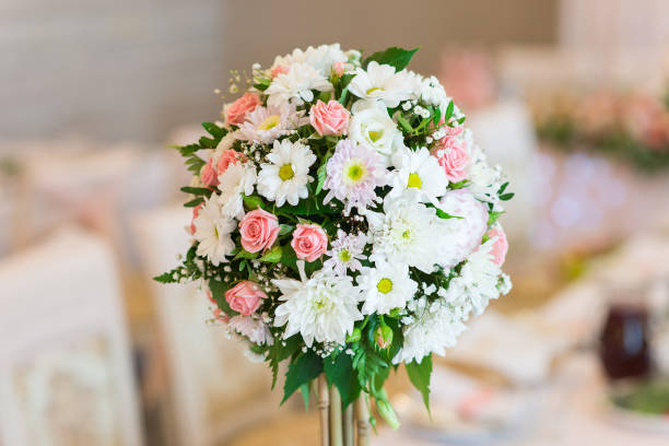 istock Flower arrangement on the wedding banquet table 1302250627