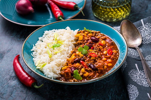 Hot Chili con carne with rice served in bowl