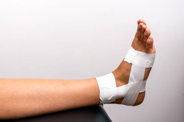 istock Injured Feet with Bandage Closeup 1302251851