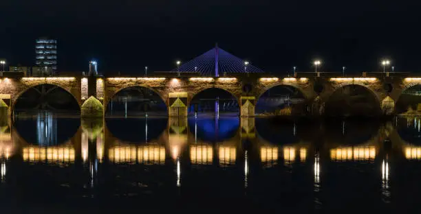 Photo of Panoramic night view of Palmas Bridge with Royal Bridge at background, in Badajoz, Extremadura, Spain