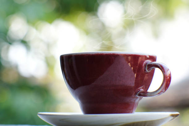 istock cup of coffee on the table background and coffee in the 1302253219