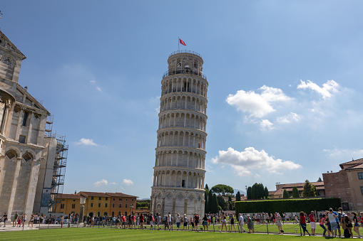 Pisa, Italy - June 29, 2018: Panoramic view of Leaning Tower of Pisa or Tower of Pisa (Torre di Pisa) is campanile on Piazza del Miracoli, or freestanding bell tower, of cathedral of Pisa city