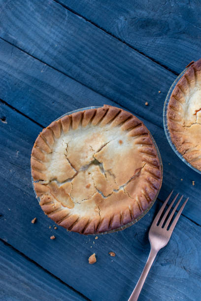 istock baked golden brown mini chicken pot pies on rustic background 1302255829