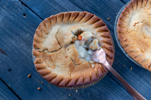 istock baked golden brown mini chicken pot pies on rustic background 1302255847
