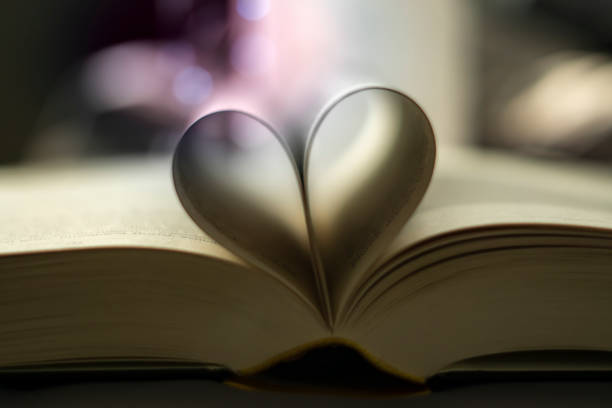 istock Heart-shaped Folded Book Art with light bubbles - valentine's day 1302256112