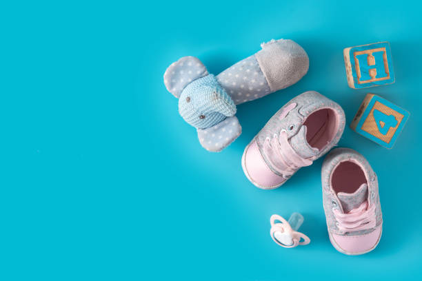 istock Baby shoes, pacifier and toys 1302256255