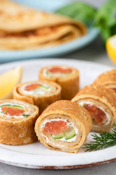 istock Crepe salmon rolls with cream cheese and cucumber 1302256460