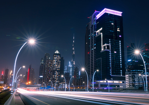 Dubai City at Night. Sheikh Zayed Road at night with light trails. The United Arab Emirates.