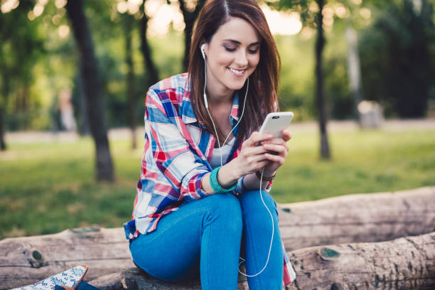 istock Woman among nature talking on video call 1302257477