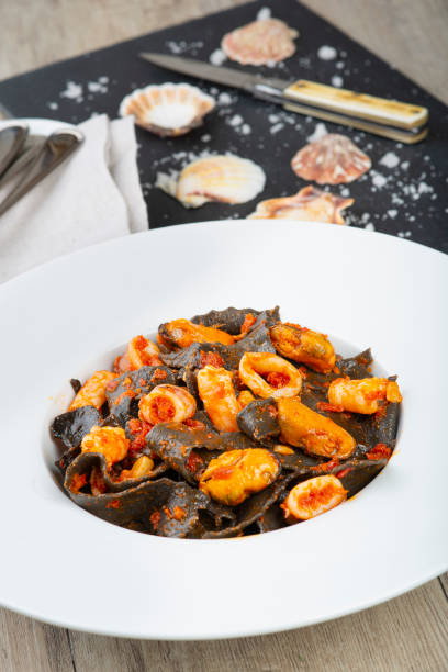 istock Squid ink pasta with seafood sauce 1302257630